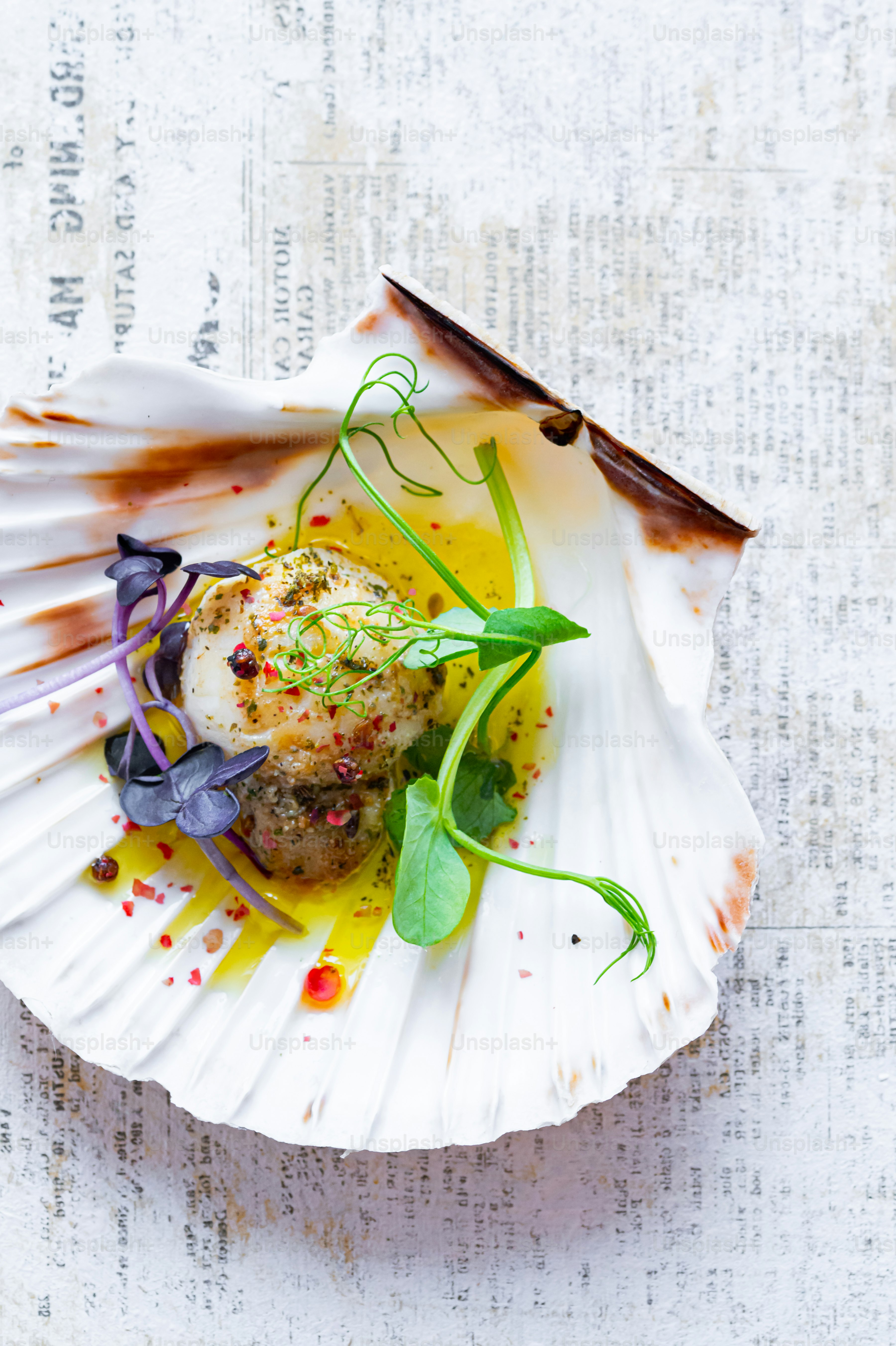 a white plate topped with a meat covered in sauce