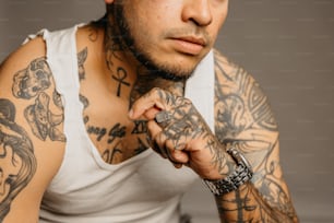 a man with a lot of tattoos on his arm