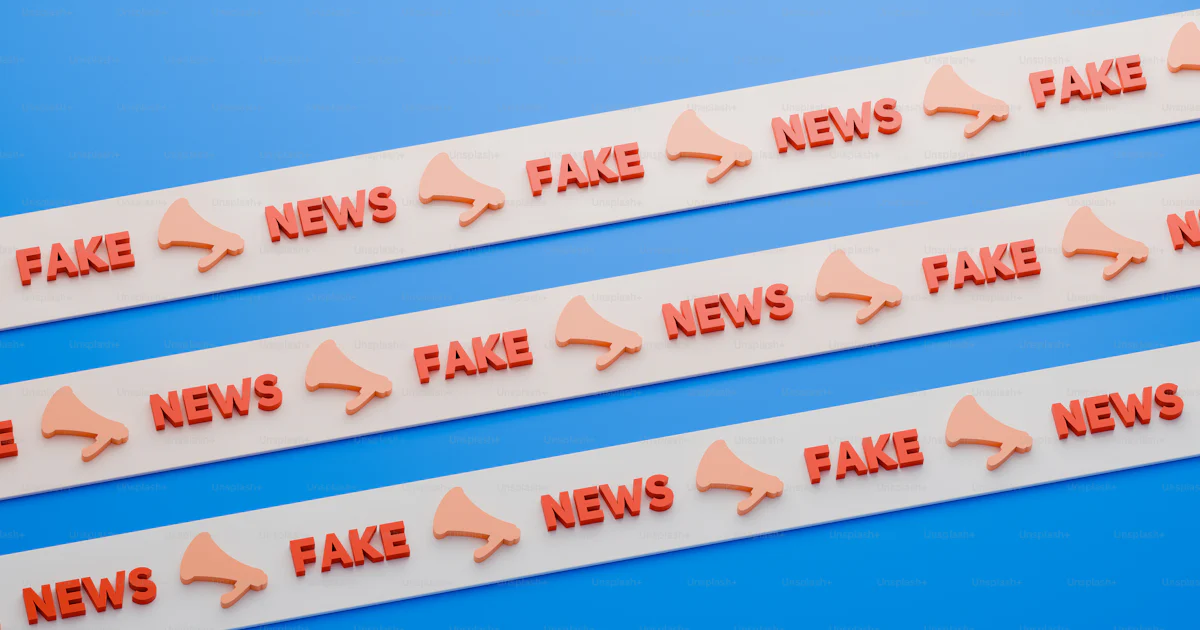 Three red fake news stickers on a blue background photo ...