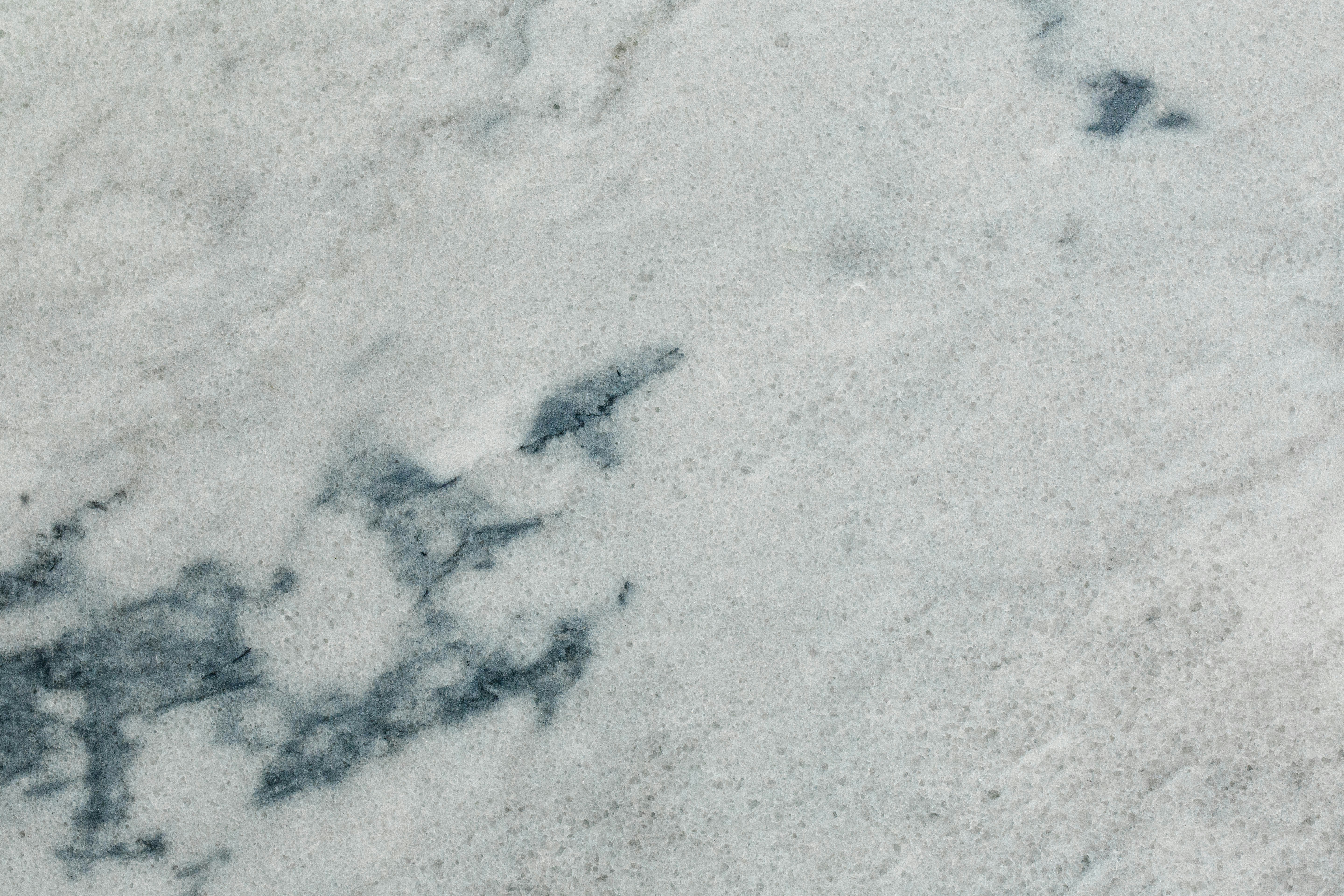 a close up of a white marble surface