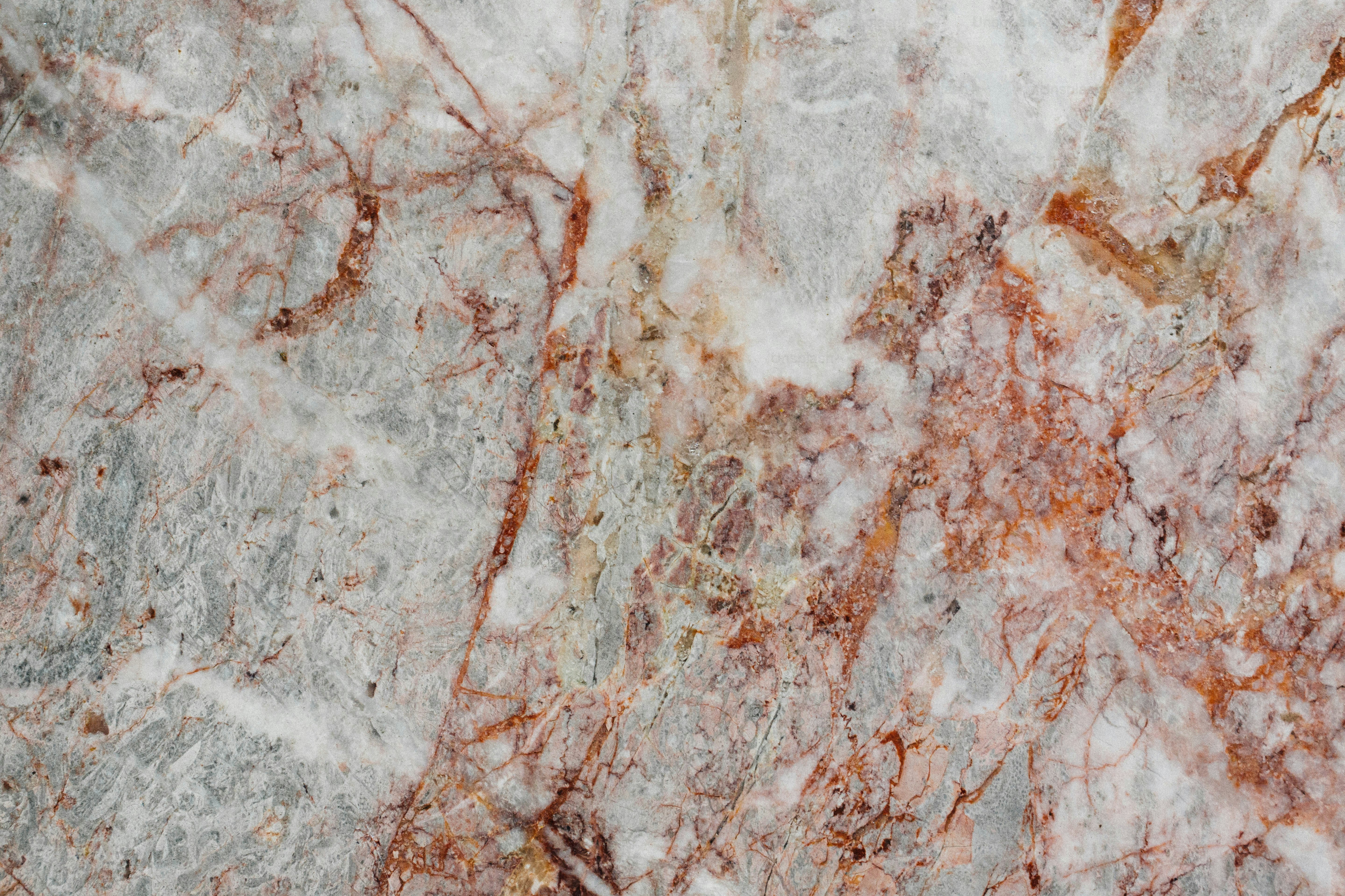 a close up of a marble surface with brown and white colors
