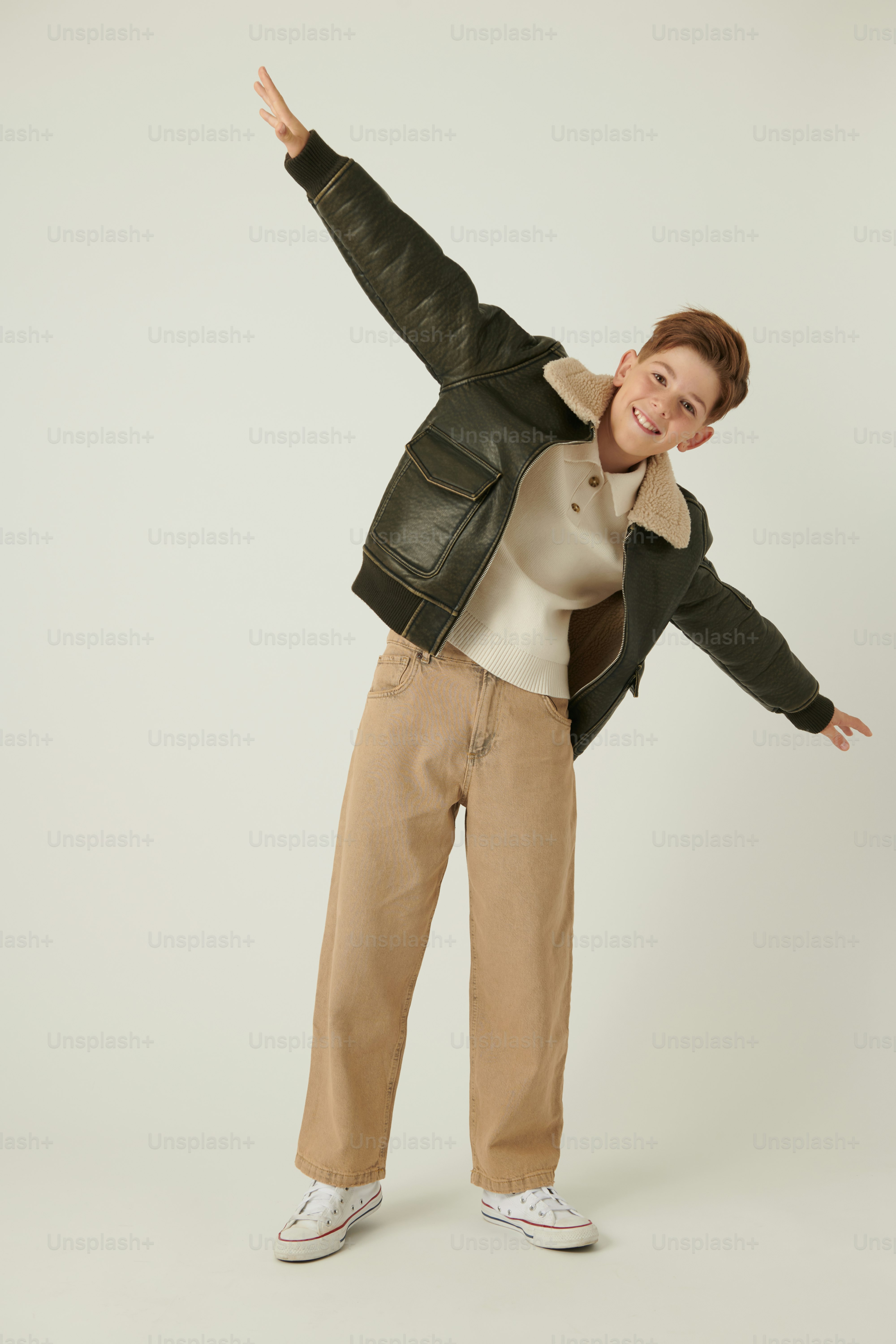 a woman in brown pants and a black jacket