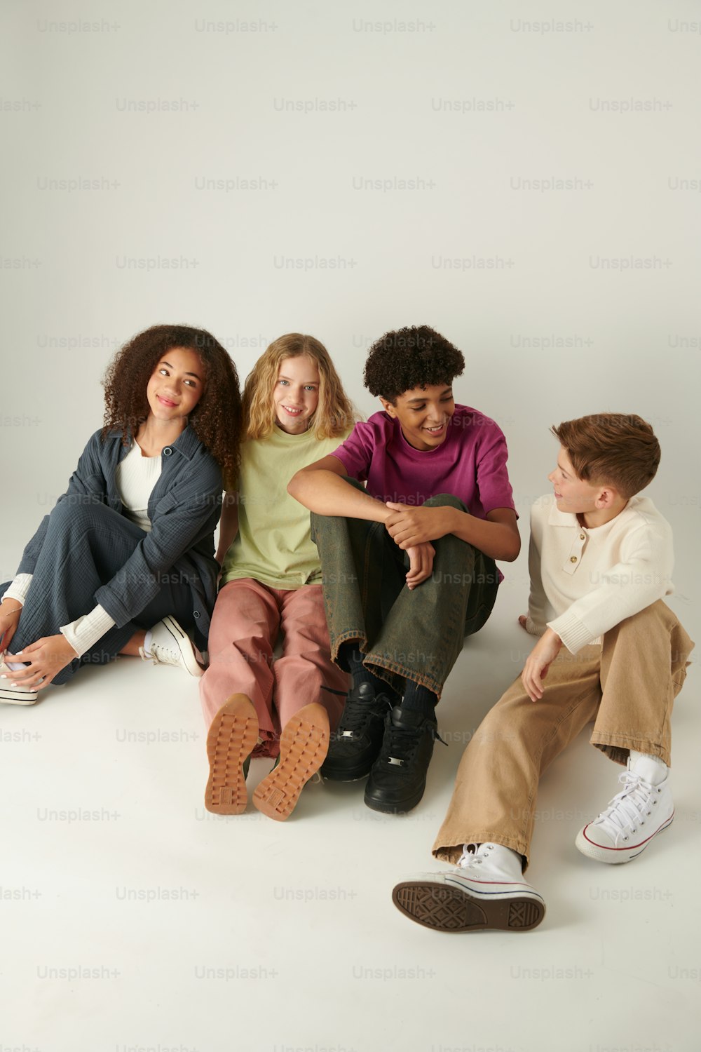a group of young people sitting next to each other