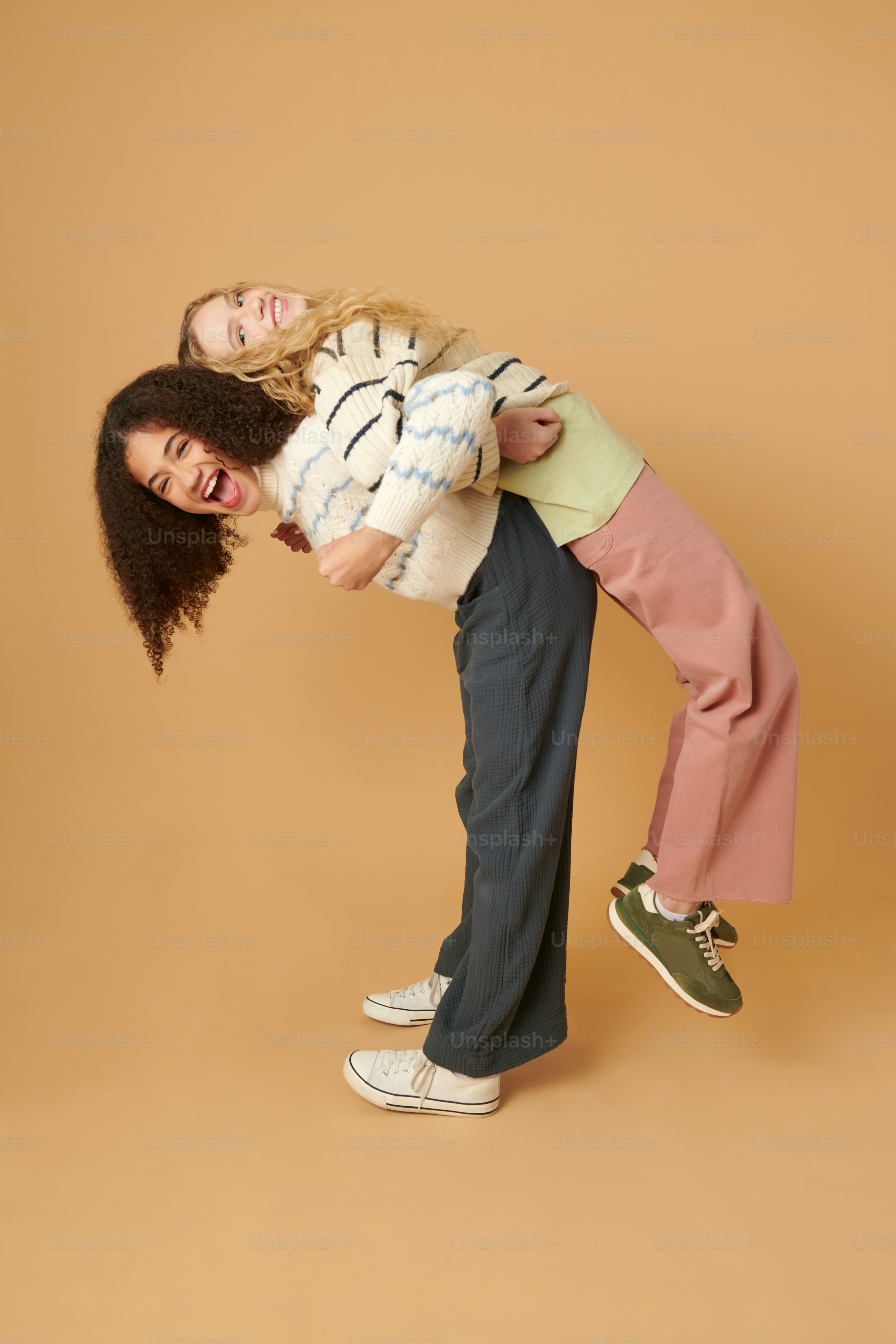 a woman holding a child on her back