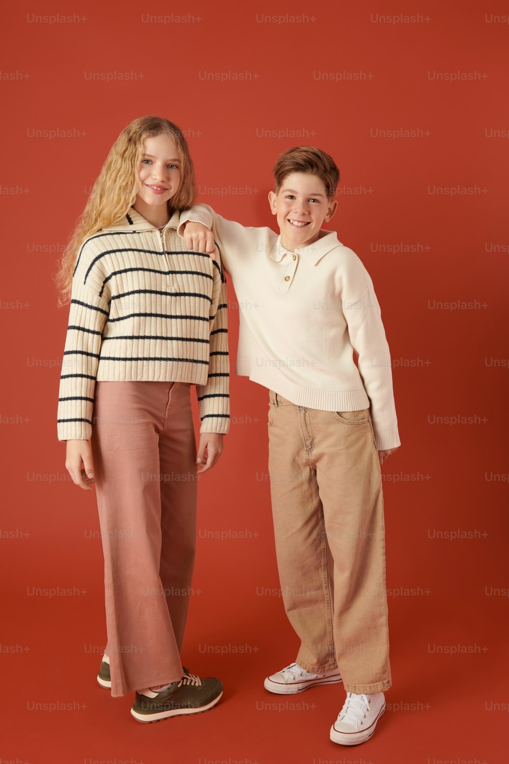a boy and a girl standing next to each other