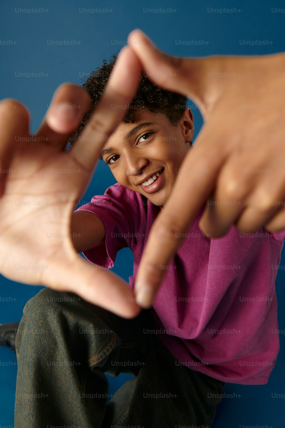 a young man making a hand gesture with his fingers