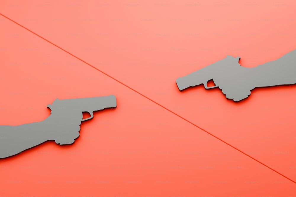 a couple of metal guns on top of a red surface