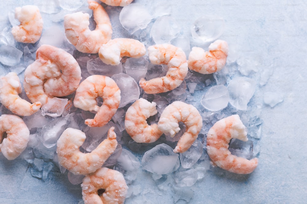 a pile of shrimp sitting on top of ice