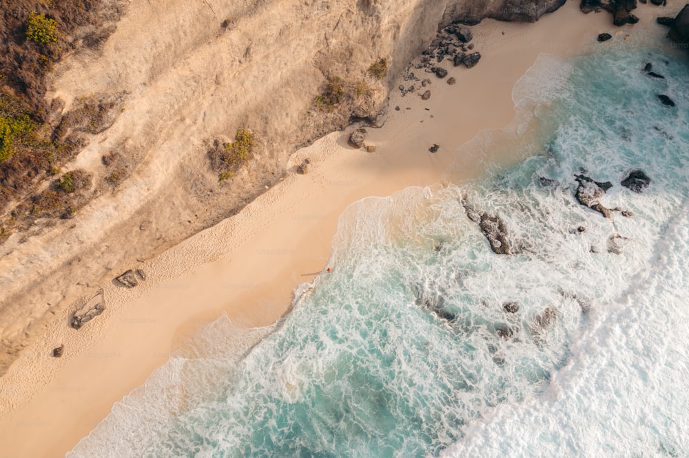 a bird's eye view of a beach and ocean