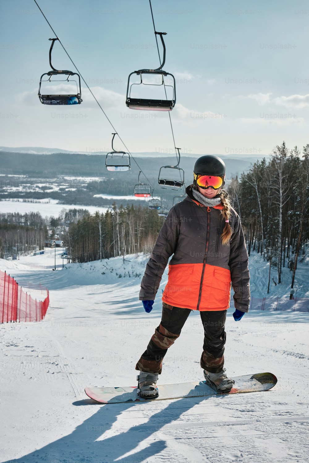 a person riding a snowboard on a snowy surface