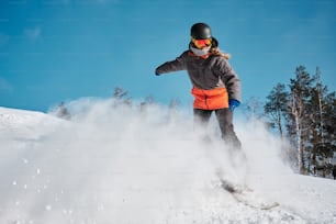 a person riding skis on a snowy surface