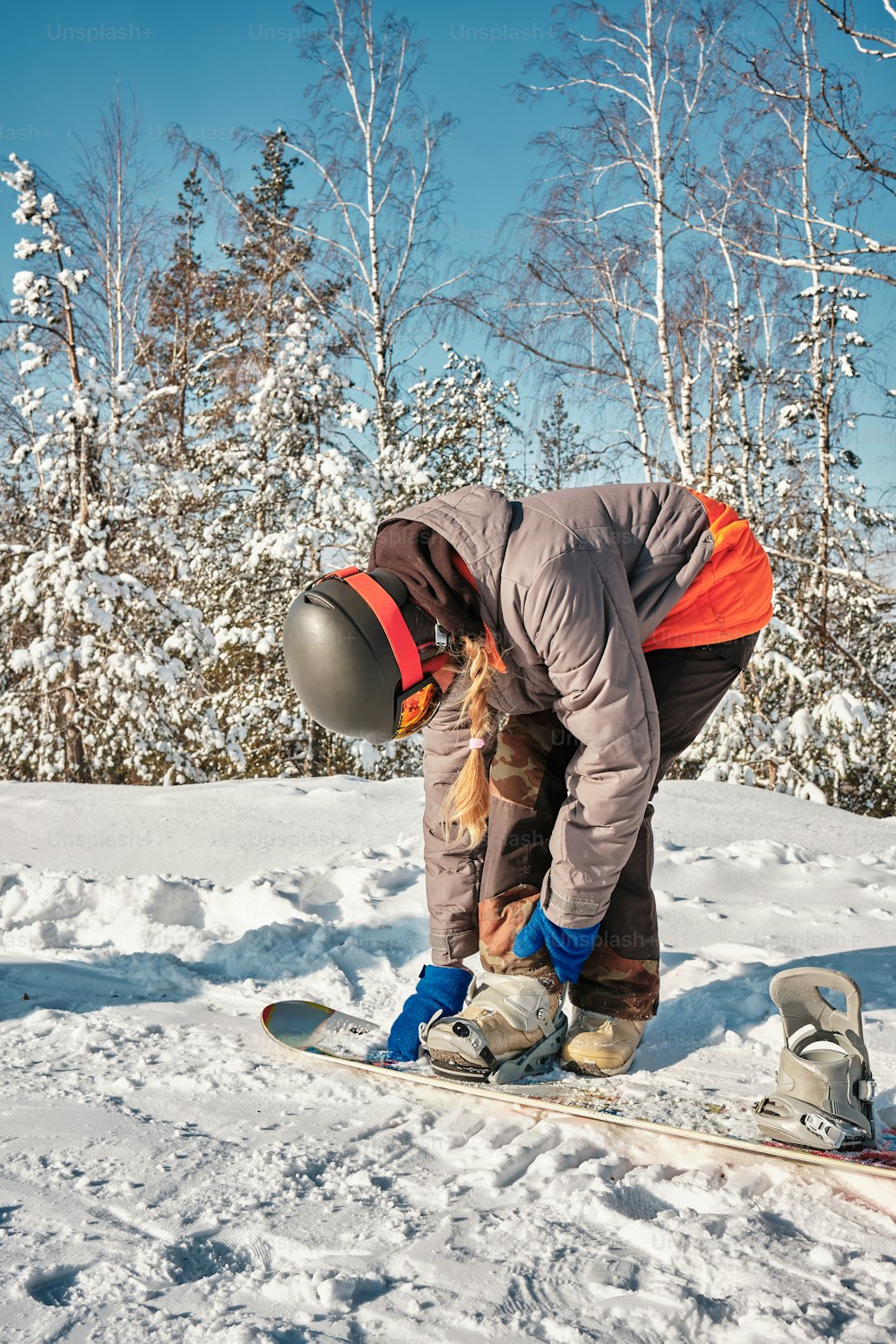 a person on a snowboard in the snow