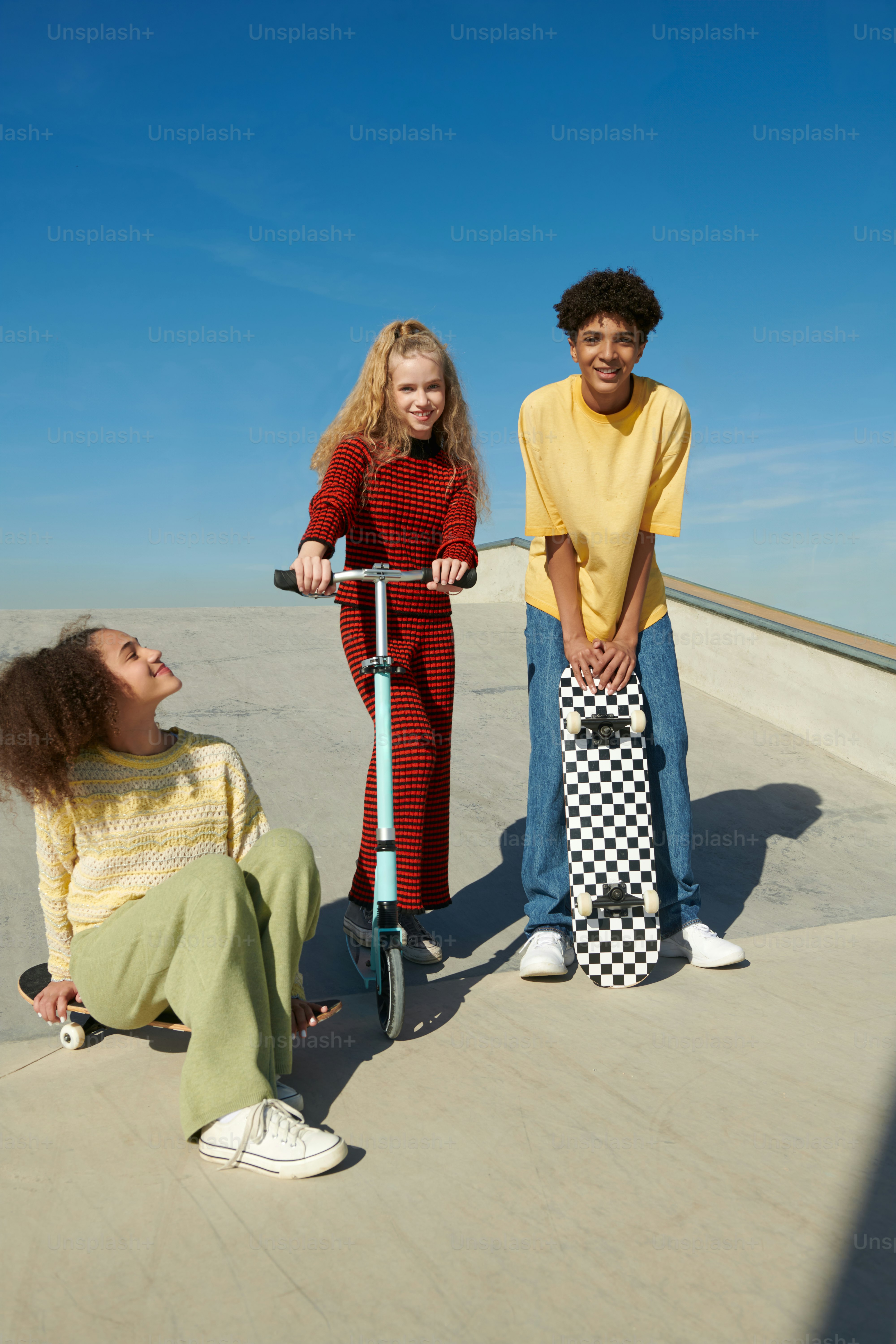 A group of people standing around a skateboard ramp photo – Friendship ...