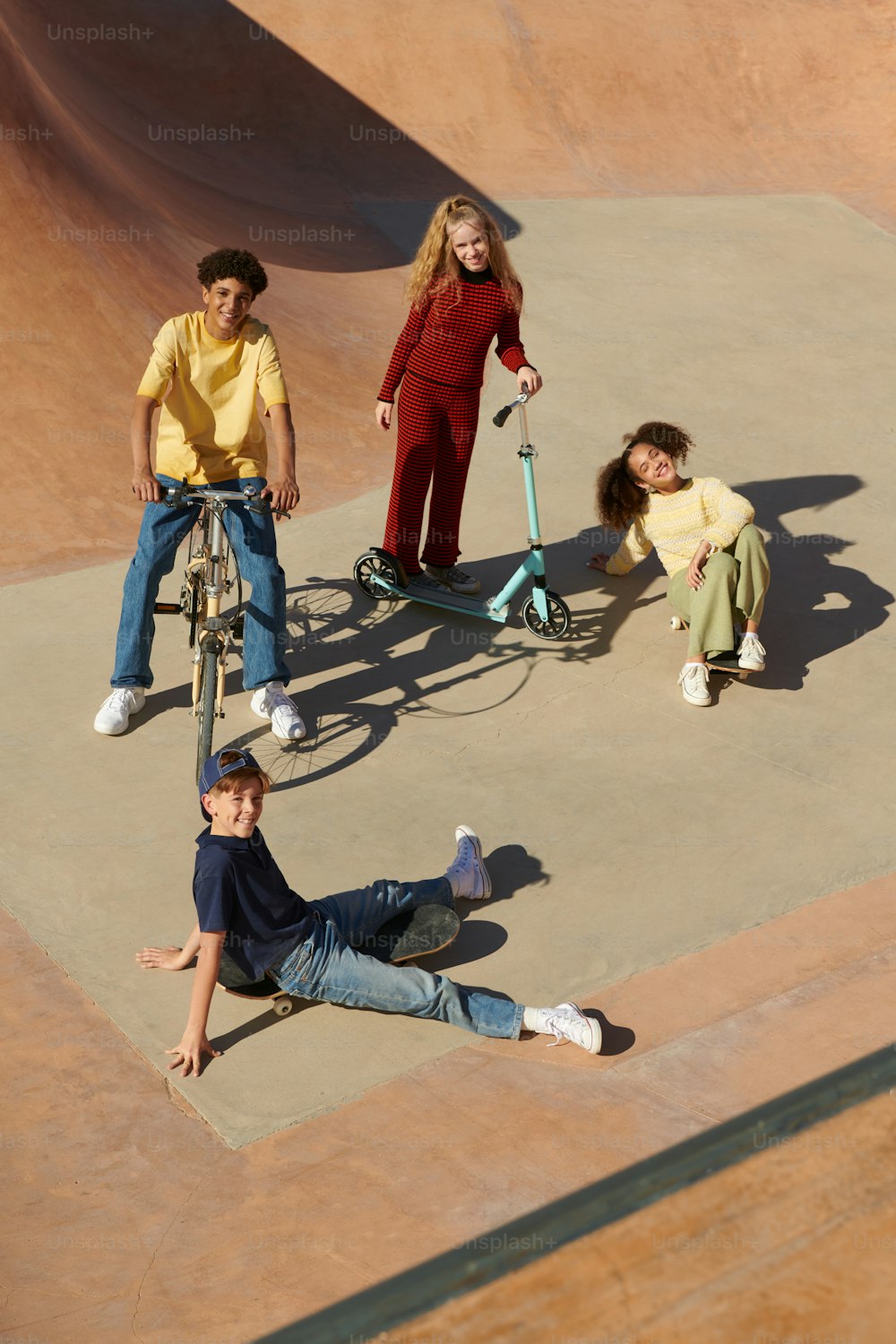 a group of people riding bikes on top of a skate park