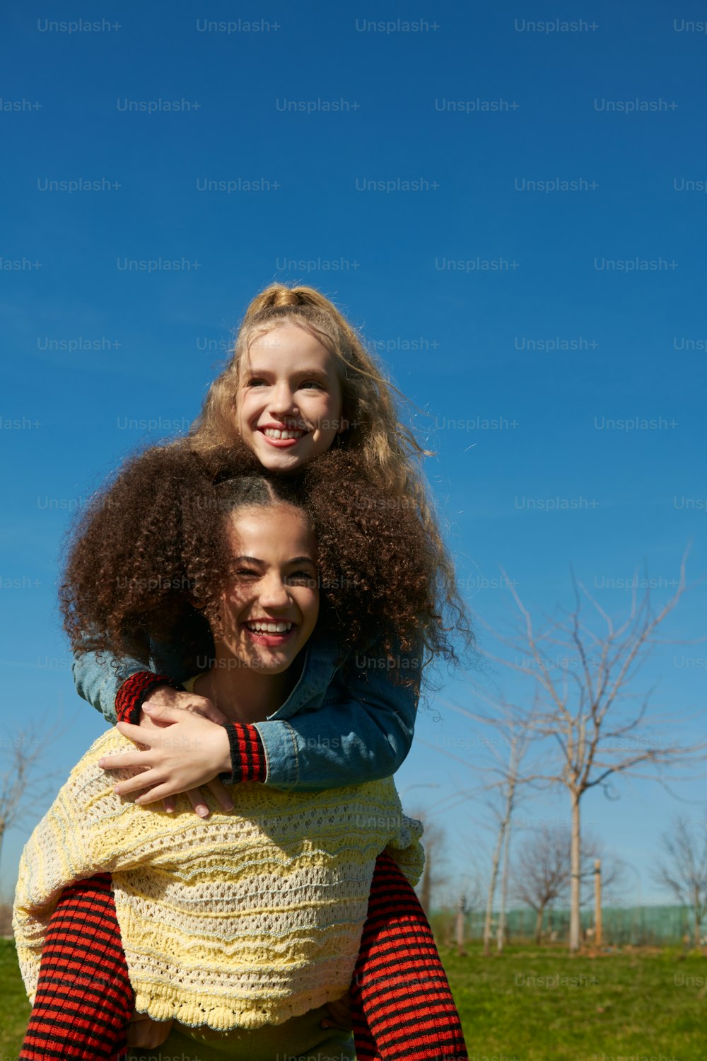 a woman holding a young girl in her arms