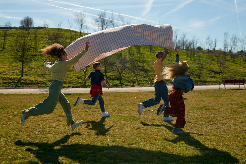 a group of children running in a field