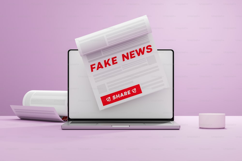 a laptop with fake news on the screen