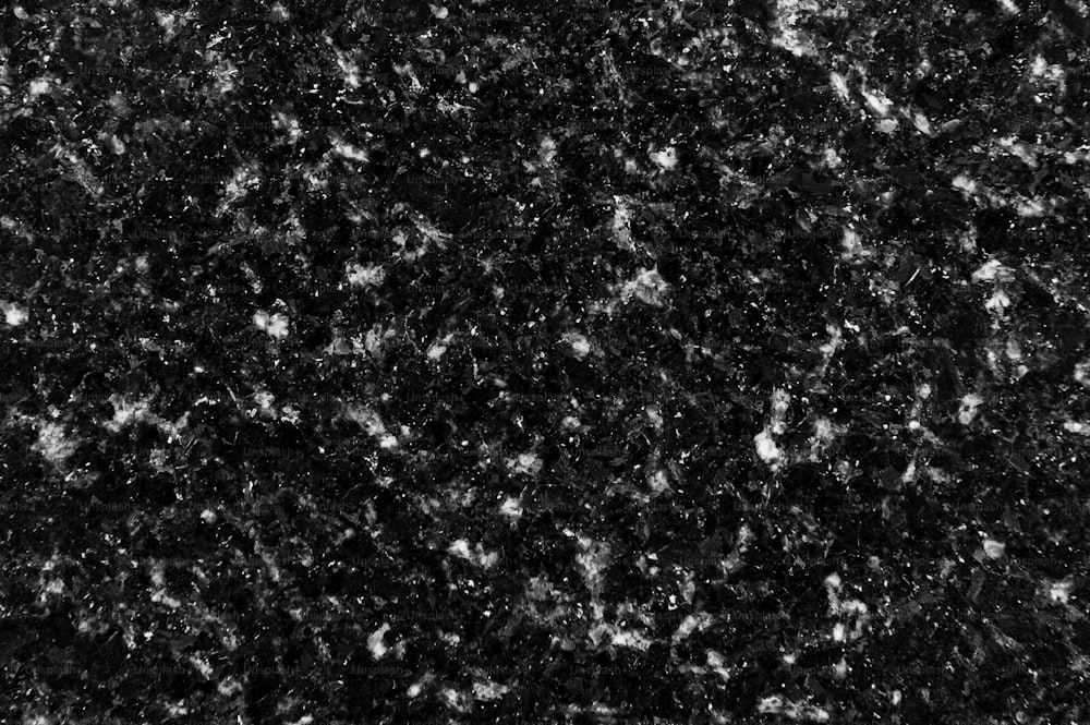 a black and white photo of a granite counter top