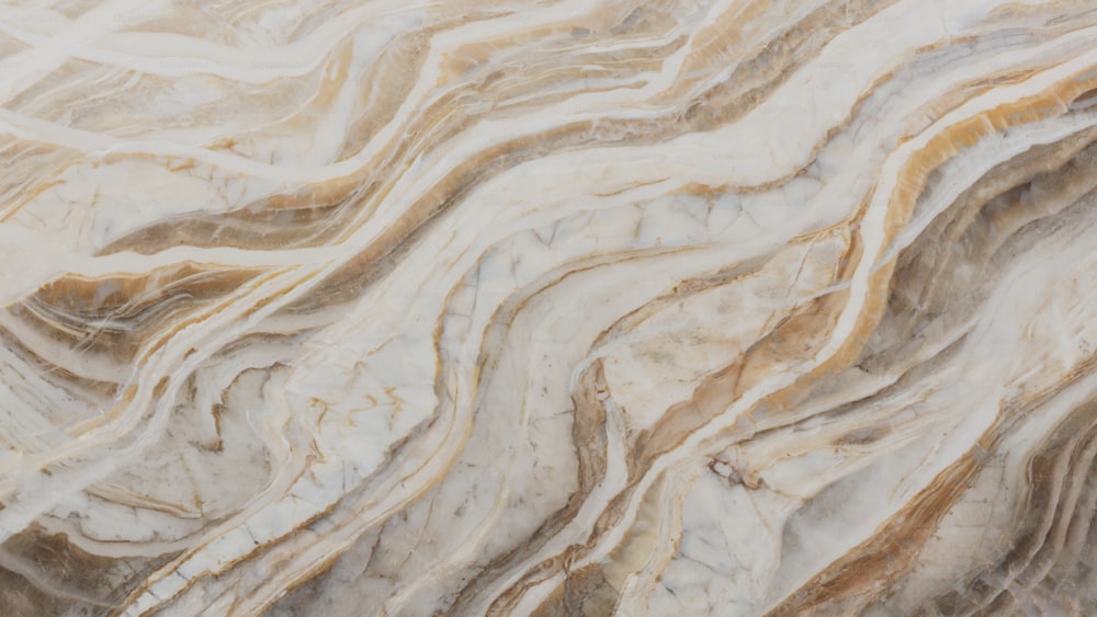 eine Nahaufnahme einer marmorierten Oberfläche mit braunen und weißen Farben