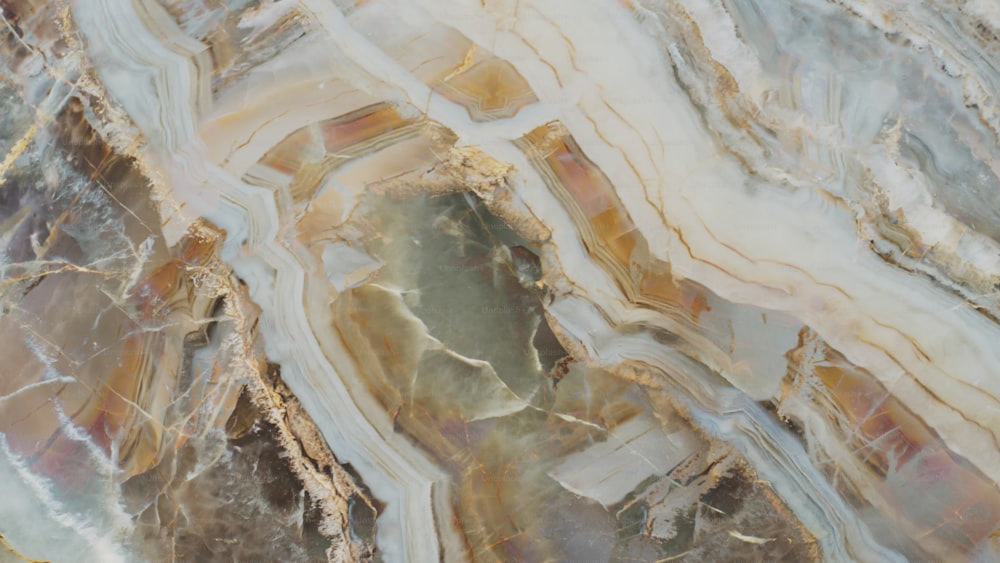 a close up of a marbled surface with brown and white colors