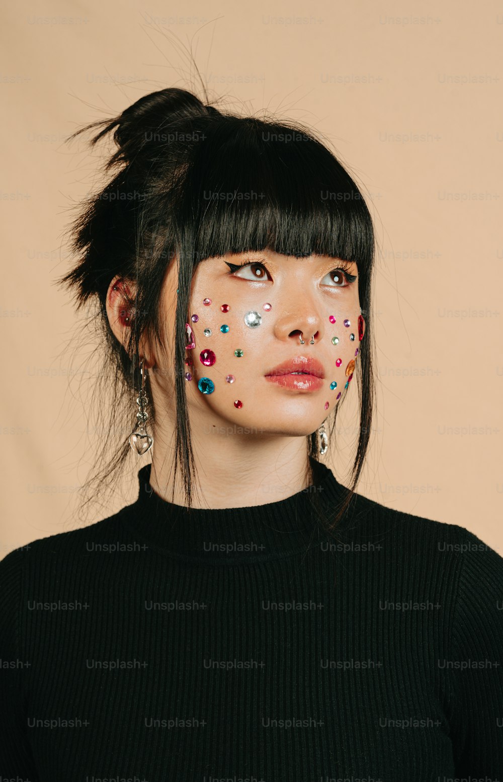 a woman with sprinkles painted on her face