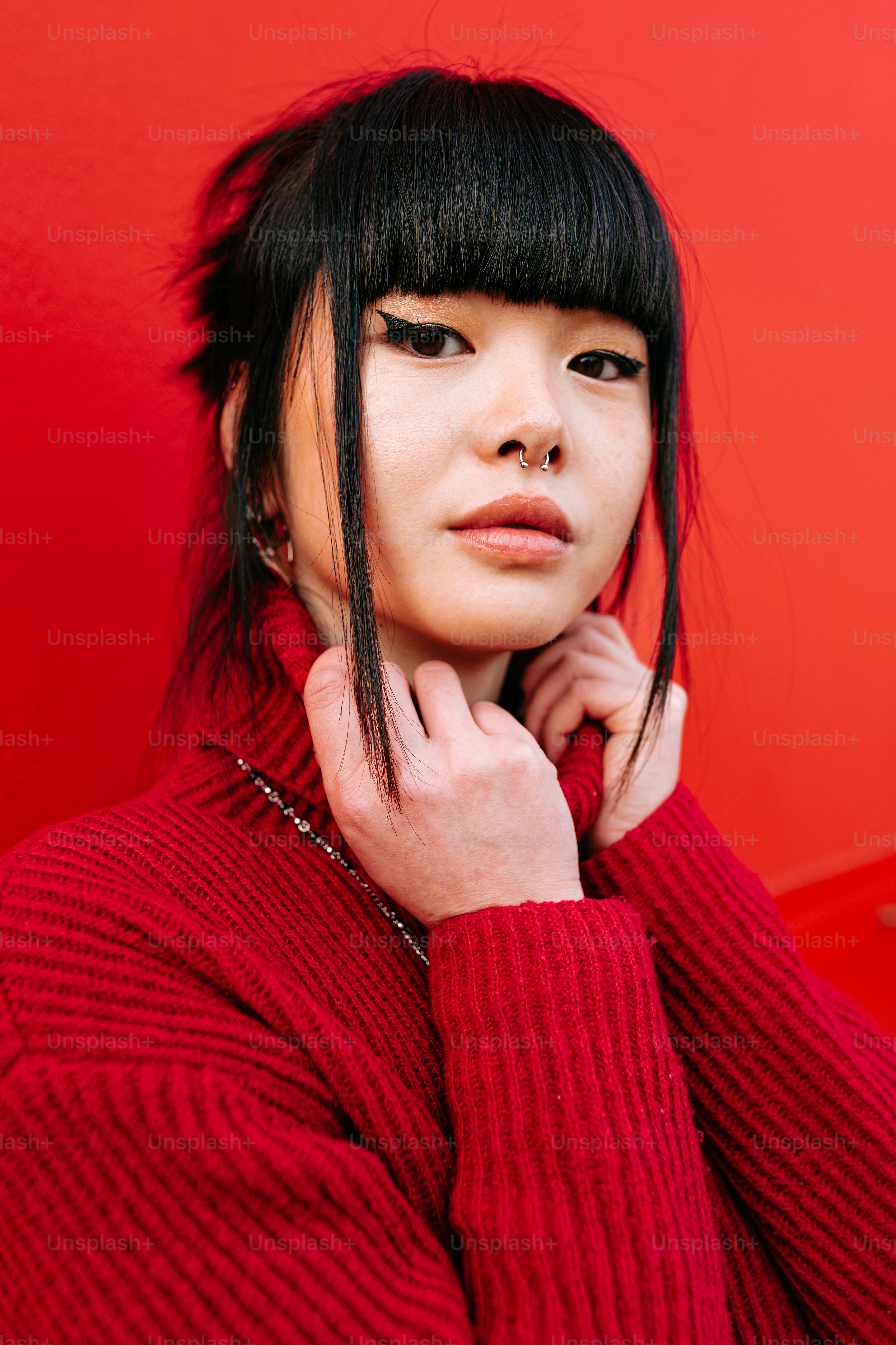 A woman with black hair wearing a red sweater photo – Fashion Image on ...
