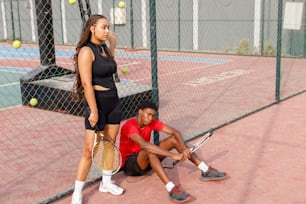 a couple of people that are on a court with tennis rackets