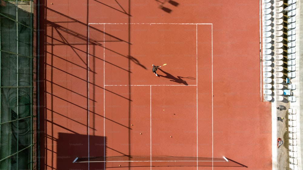 a person is playing tennis on a tennis court
