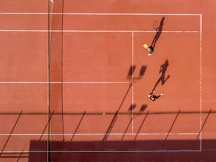 a tennis court with two people playing tennis