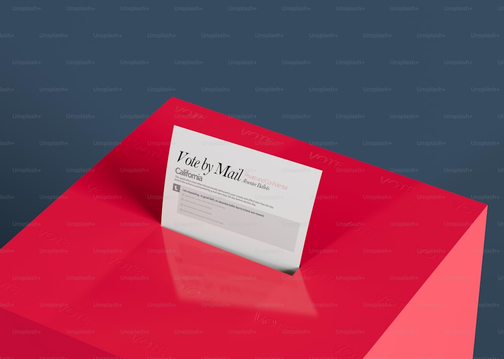 a red table with a white business card on it