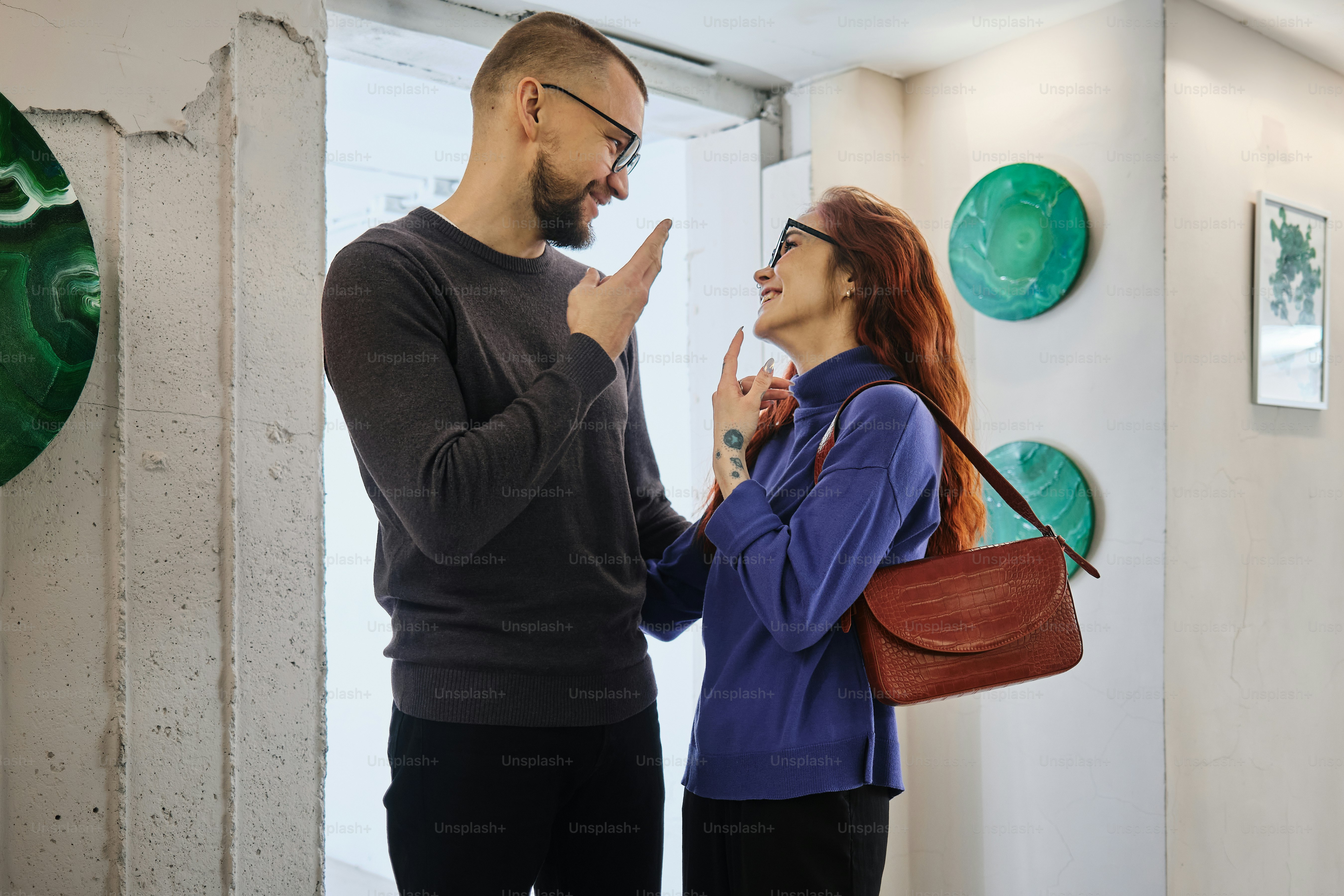 A man and a woman standing next to each other photo – Couple Image on ...