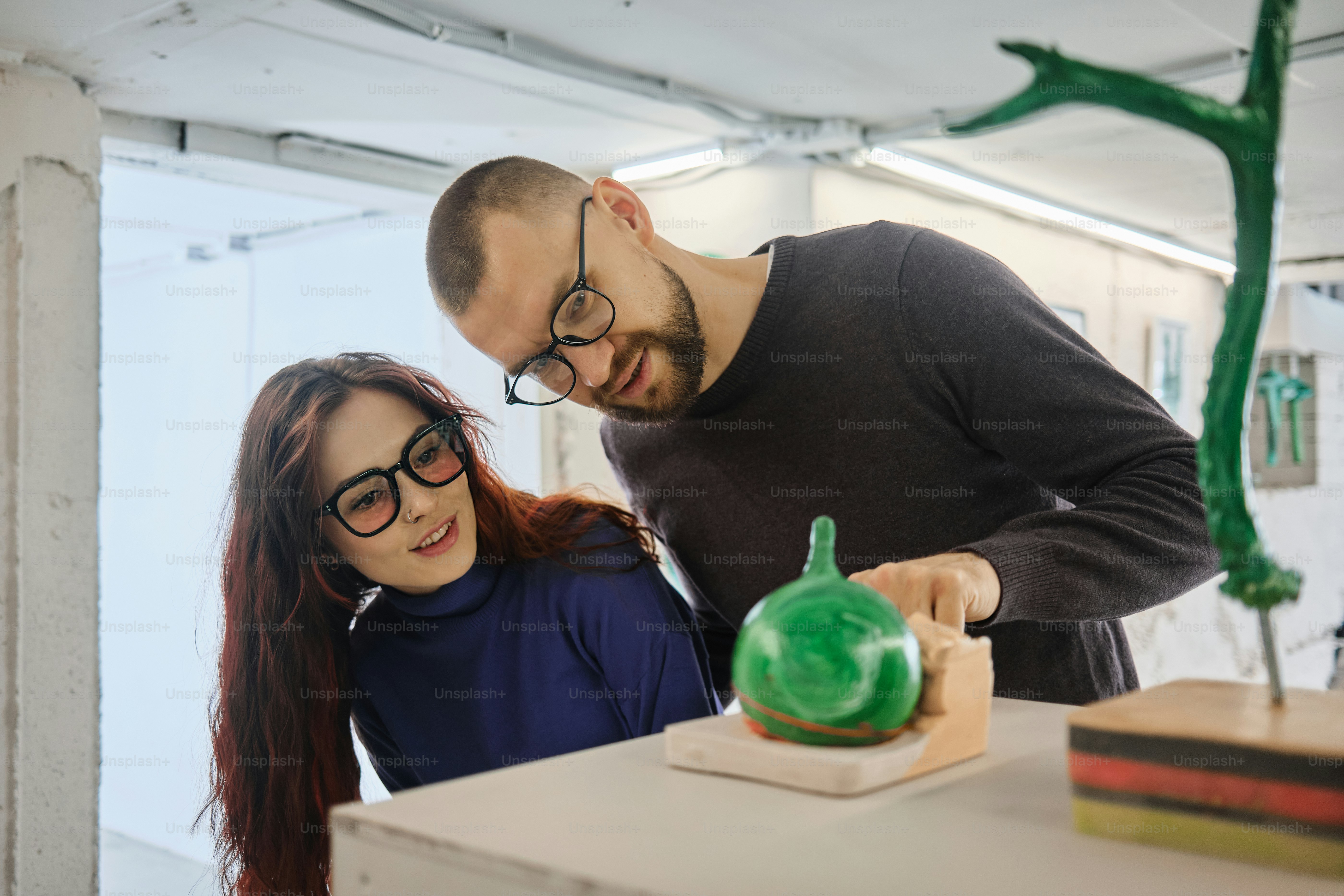 a man standing next to a woman in a room