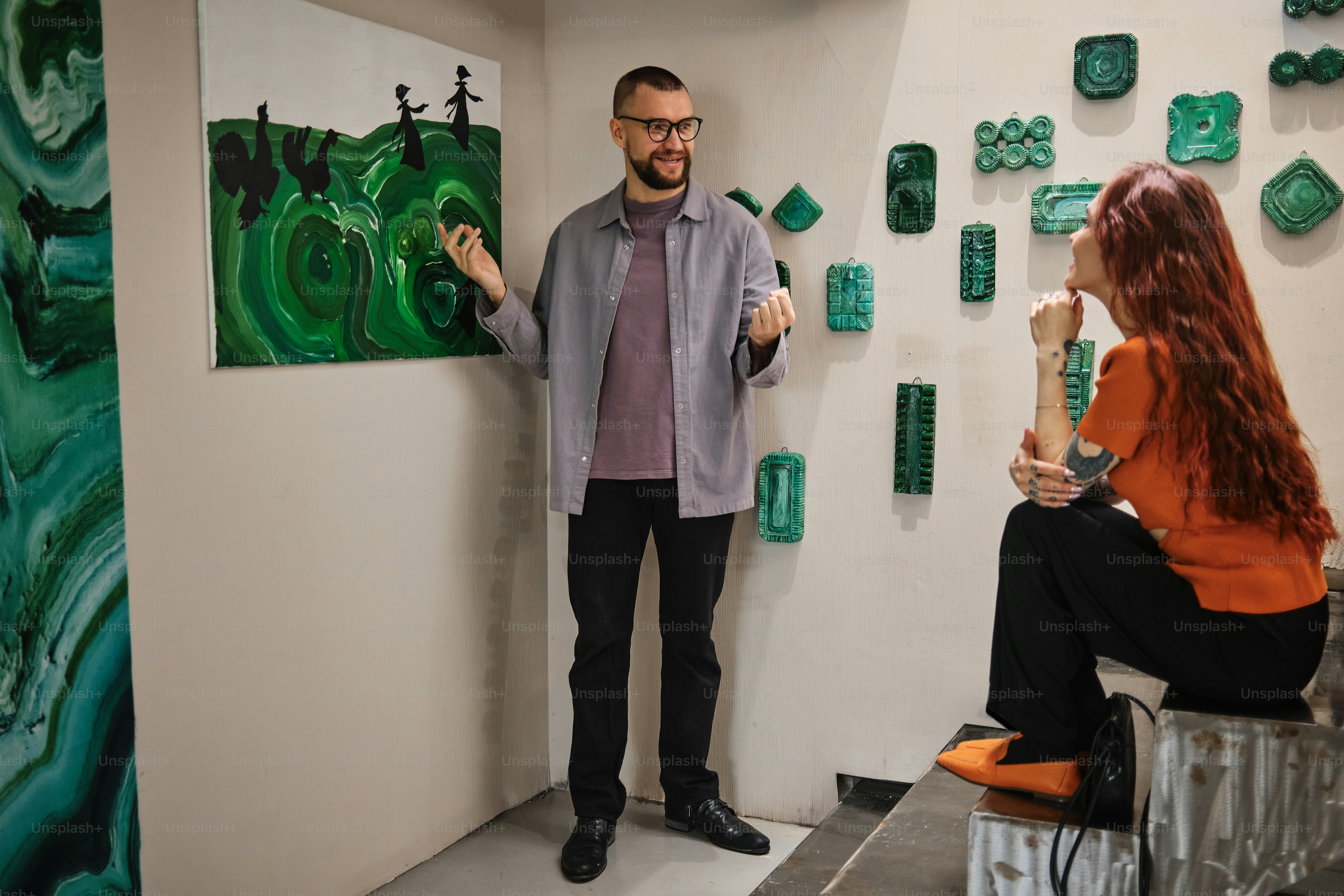 a man standing next to a woman in a room