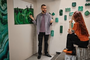 a man standing next to a woman in a room