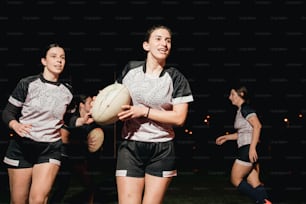 a group of young women standing next to each other holding a white frisbee