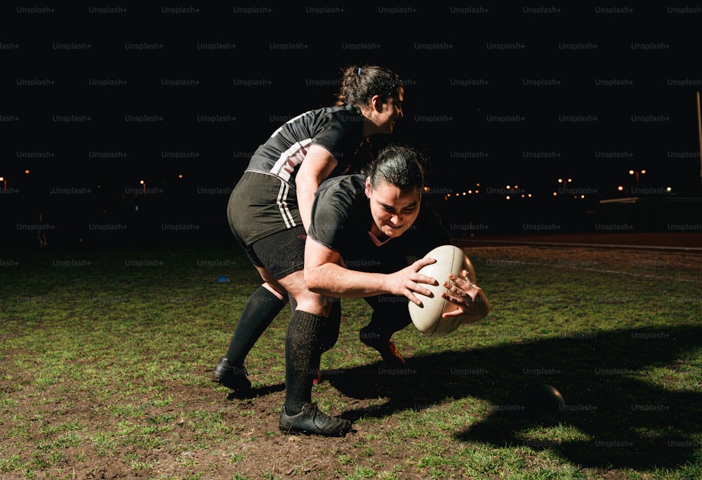 a couple of people playing a game of frisbee