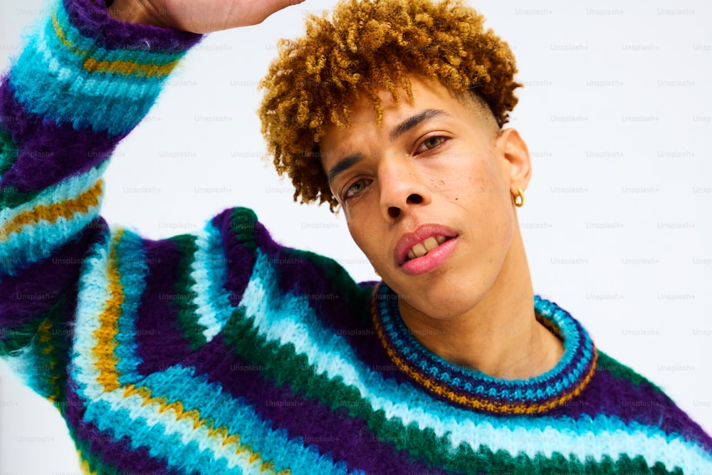 a close up of a person wearing a sweater