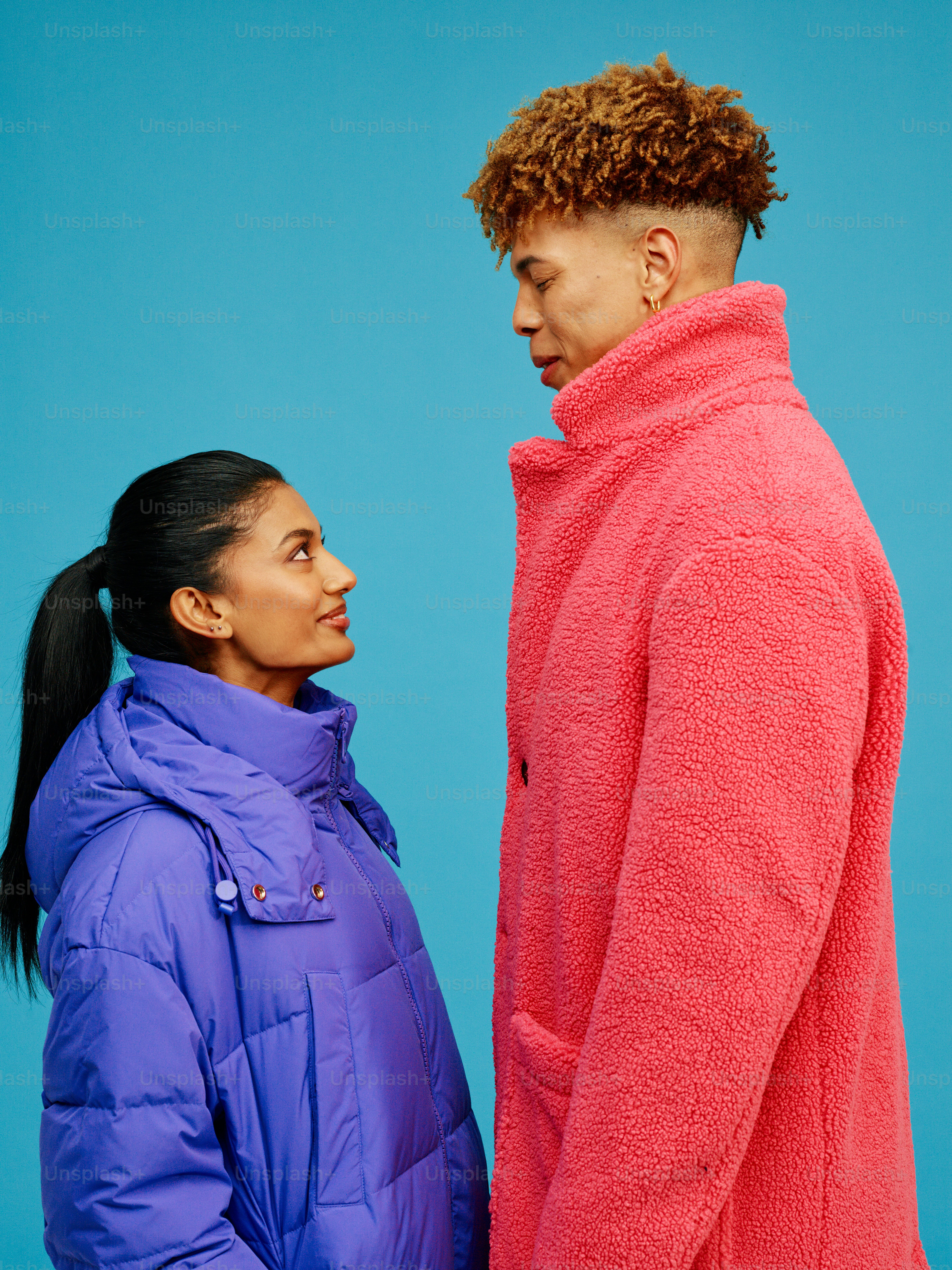 A man and a woman standing next to each other photo – Fashion Image on ...