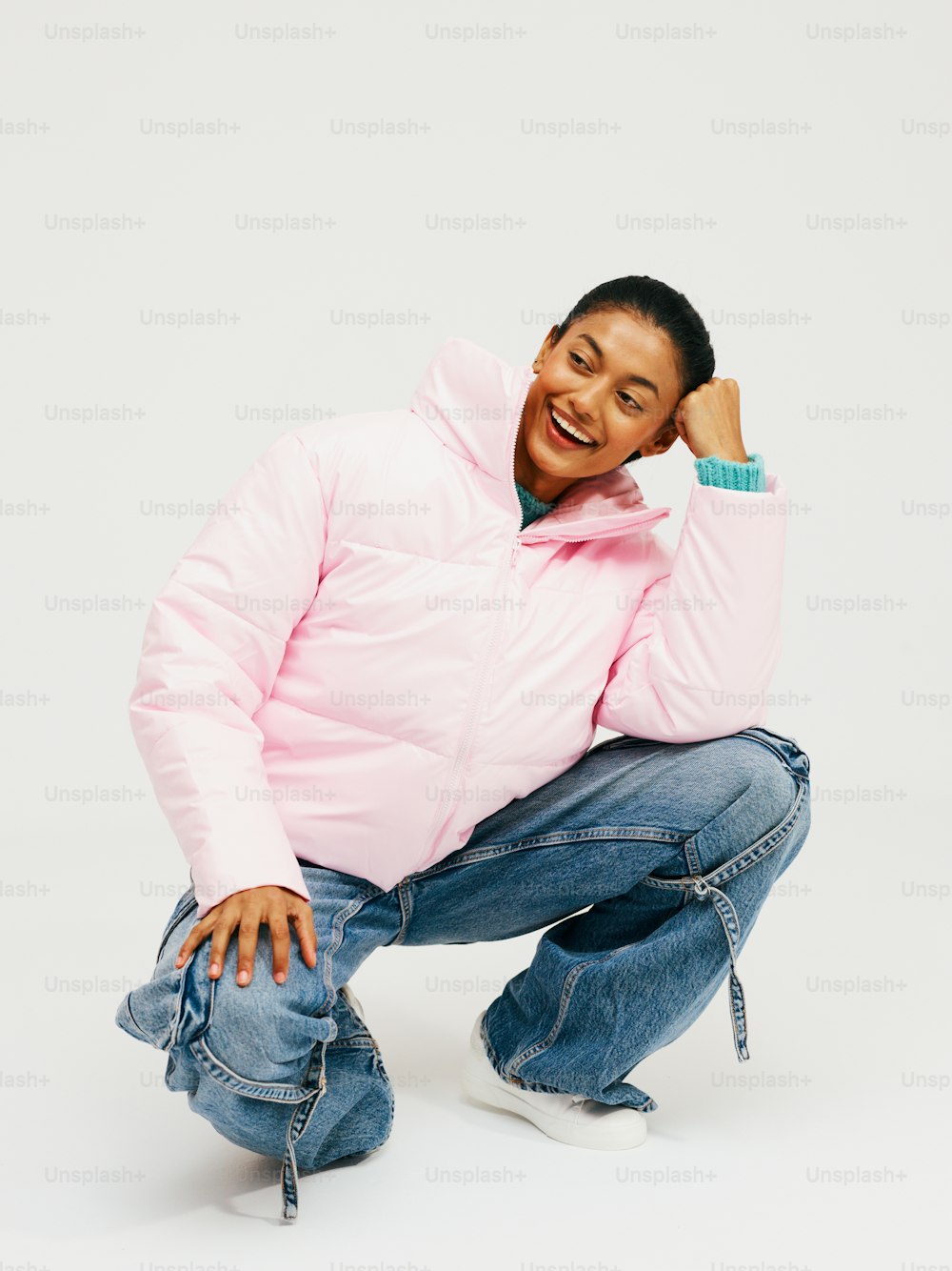 a man in a pink jacket posing for a picture