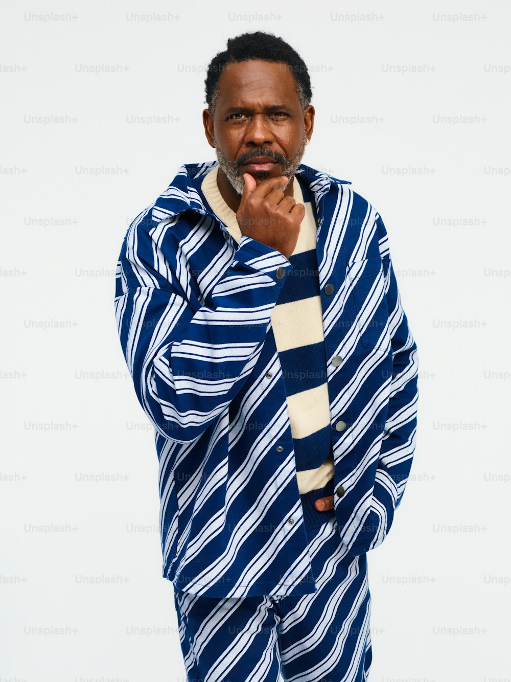 a man wearing a blue and white striped shirt
