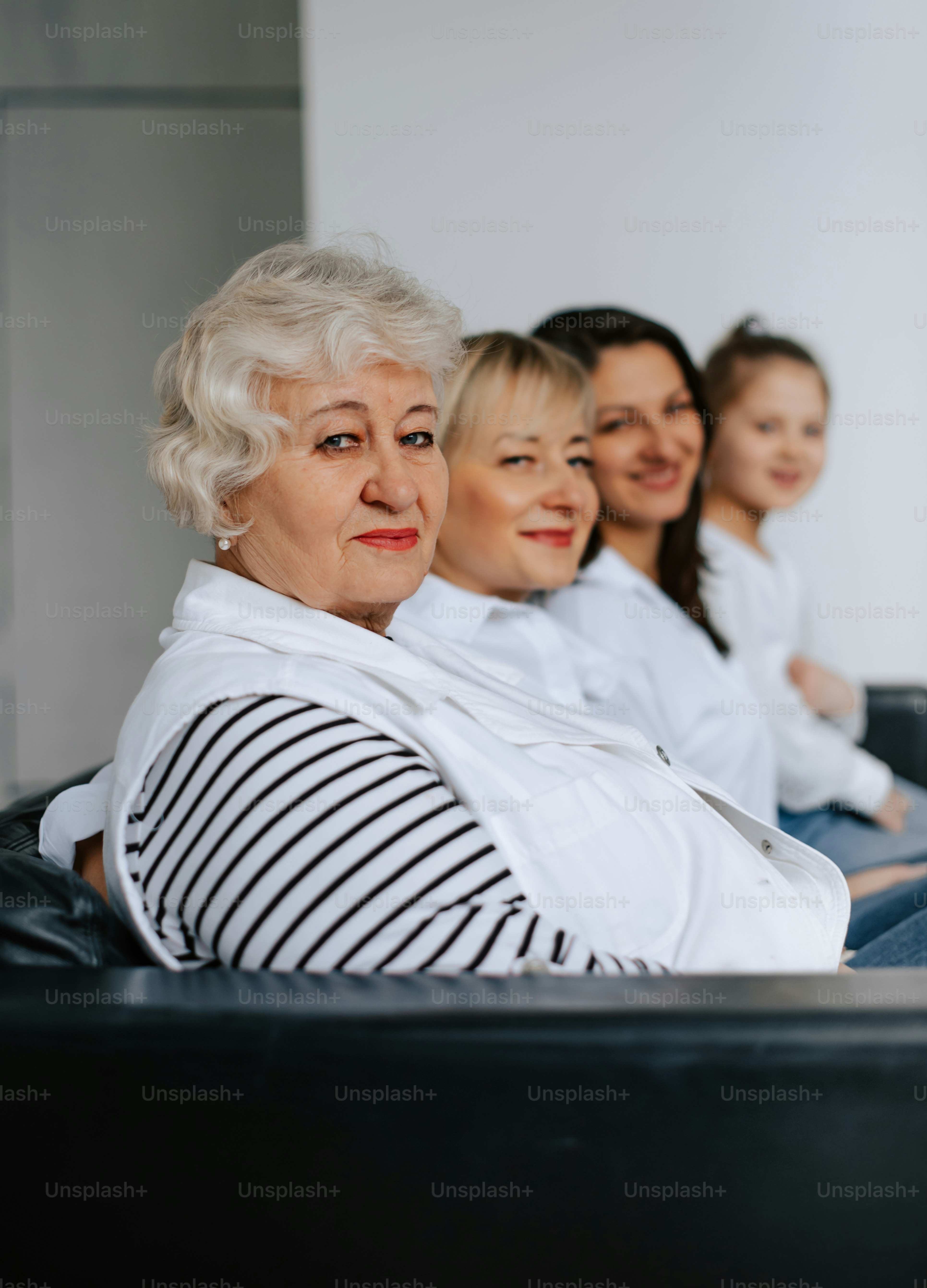 a group of women sitting next to each other