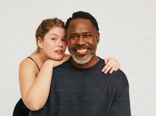 a man and a woman posing for a picture