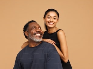 a smiling man and woman pose for a picture