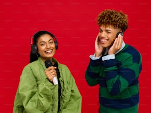 a man and a woman with headphones on