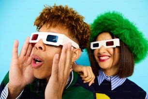 a man and a woman wearing 3d glasses