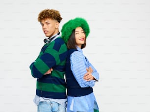 a man and a woman with green hair standing next to each other