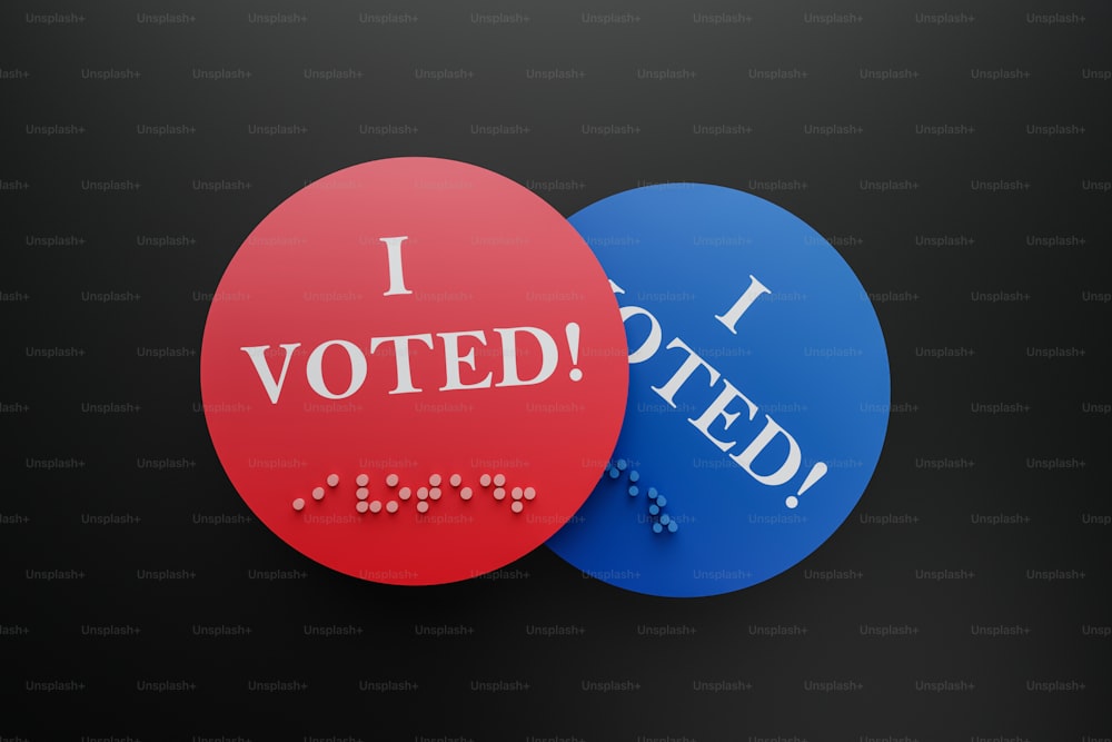two red and blue buttons that say i voted