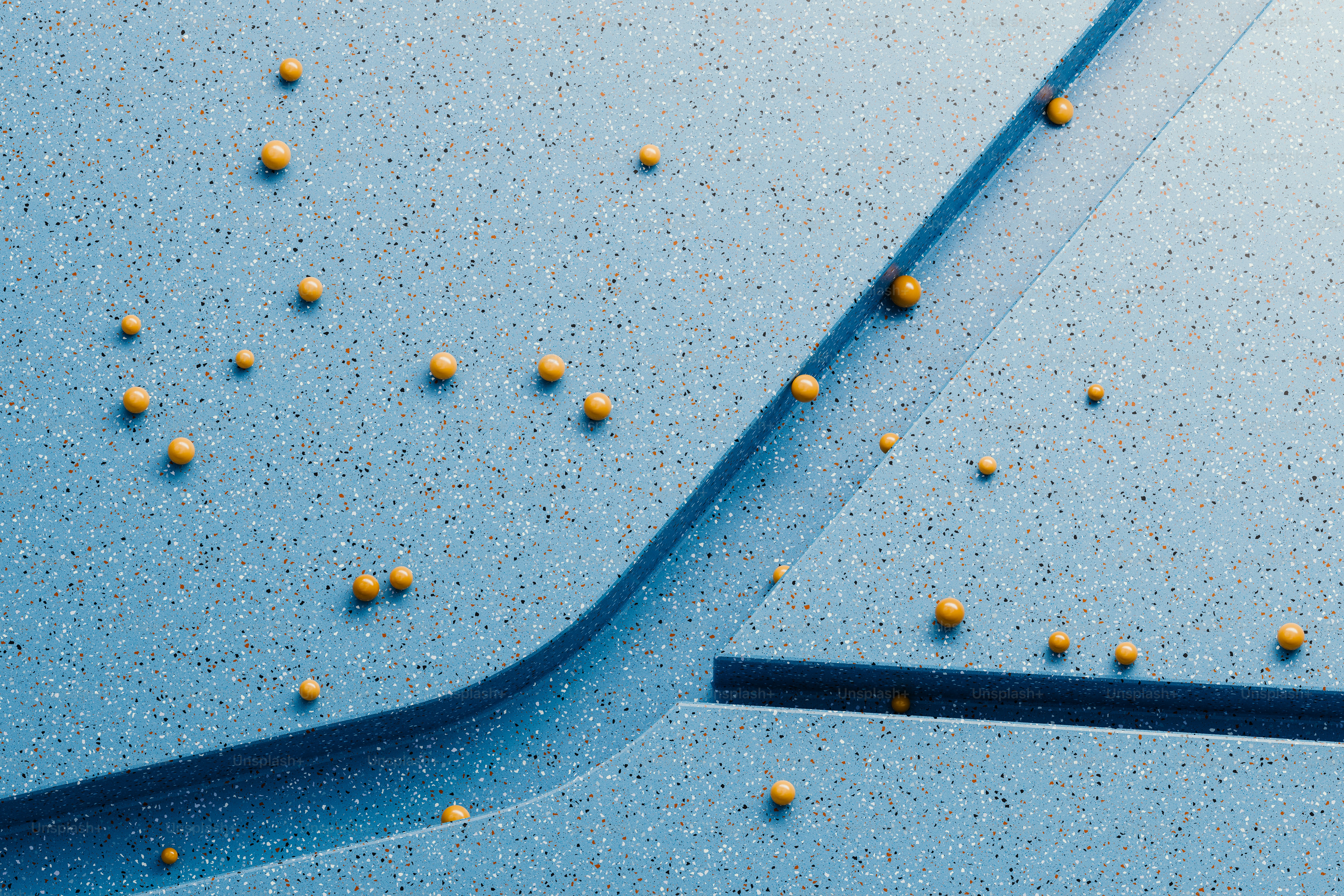 a blue surface with yellow balls on it