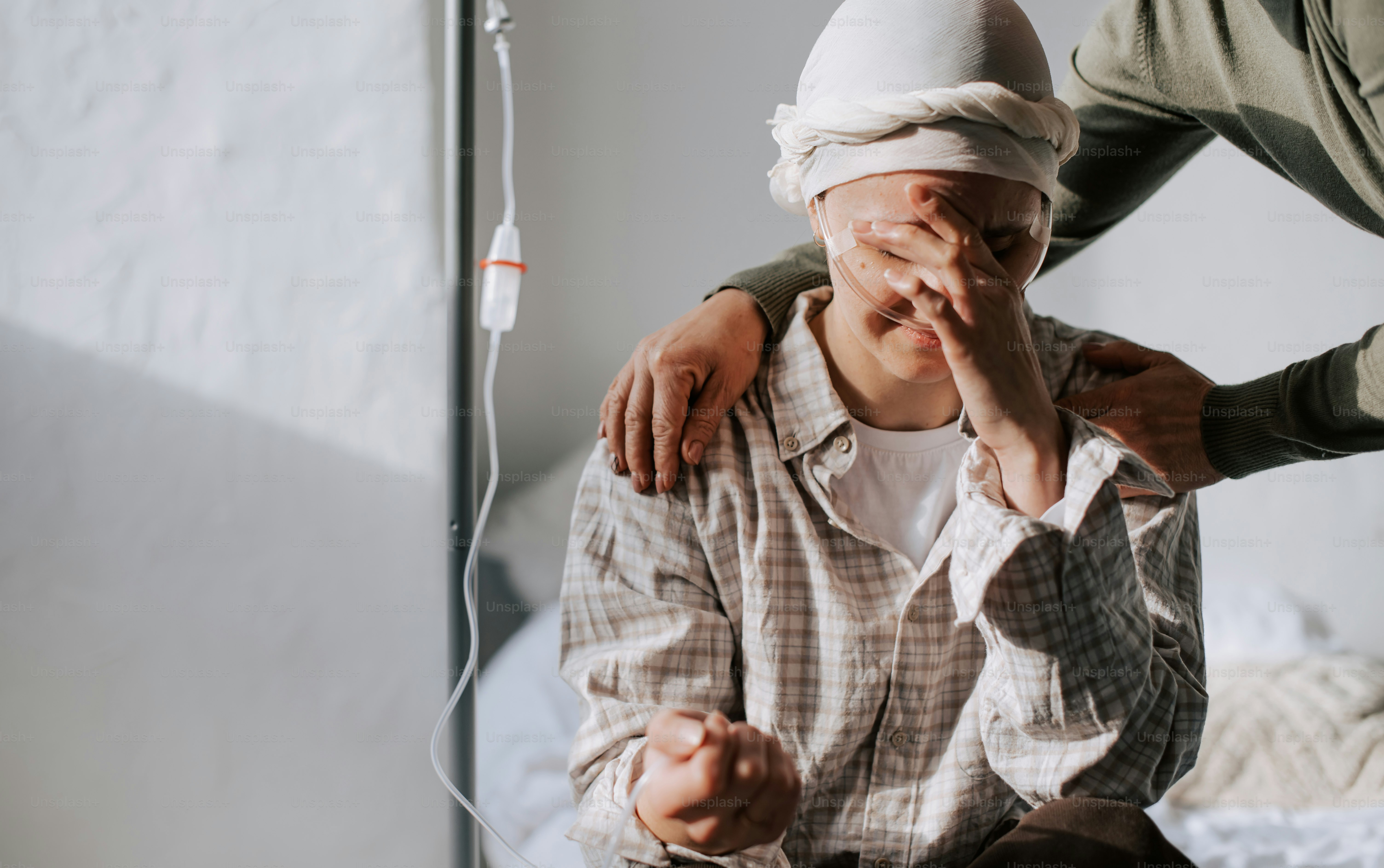 a man with a bandage on his head and another man with a bandage on his