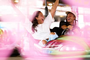 a man and a woman riding a roller coaster